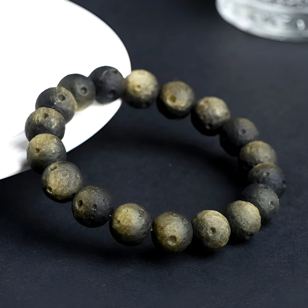 Obsidian crater ball bracelet with grinding texture in silver or gold meteorite finish