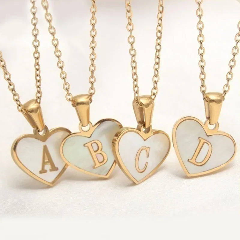 Gold plated heart necklace with white shell centre on a 45+5cm chain
