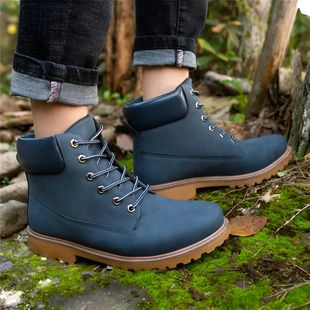 Men's pink Martin boots with velvet lining, flat sole, and round toe on a lace-up high-top.