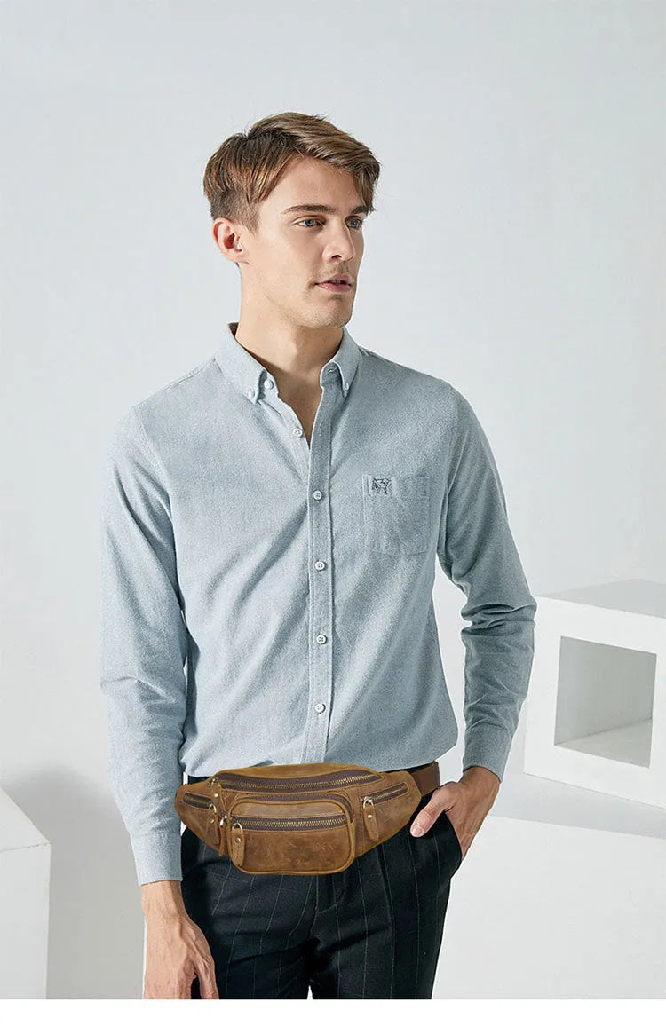 Retro brown leather messenger bag with single shoulder strap shown open.