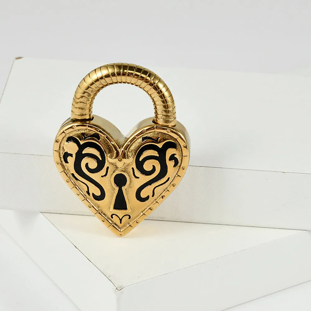 Close-up of a women's stainless steel heart-shaped ear piercing in a gold colour finish.