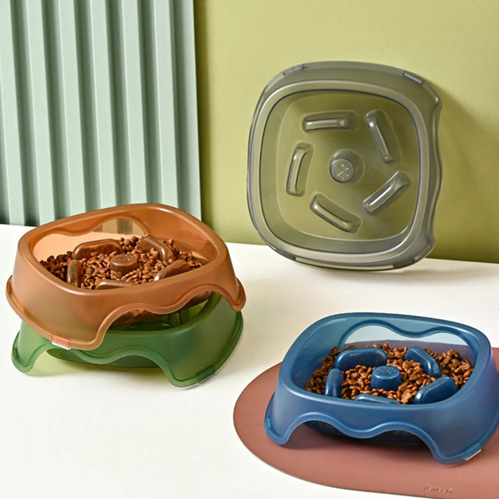Blue plastic slow feeder dog bowl with internal maze pattern for portion control.