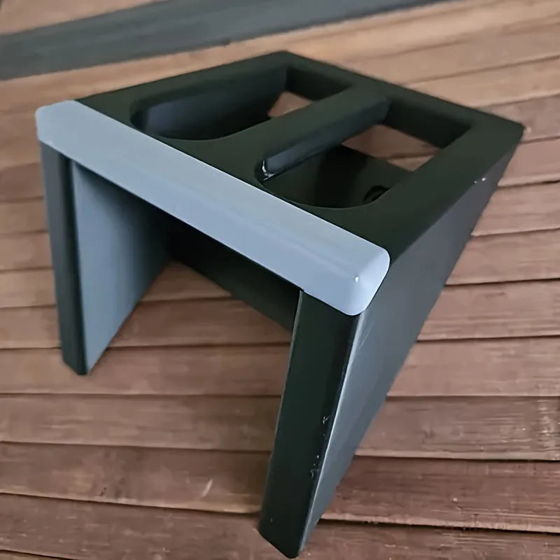 Black plastic pistol display stand for toy guns and cosplay accessories.