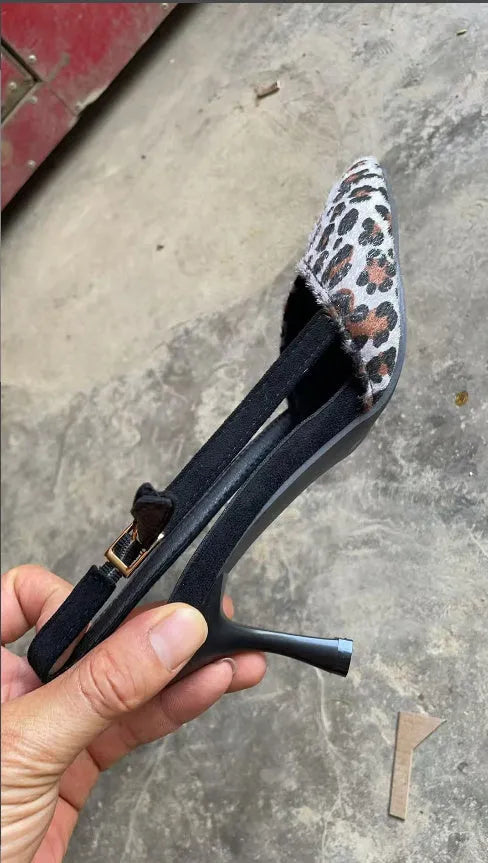 Scattered pointed toe women's sandals in leopard print suede, high heel style.