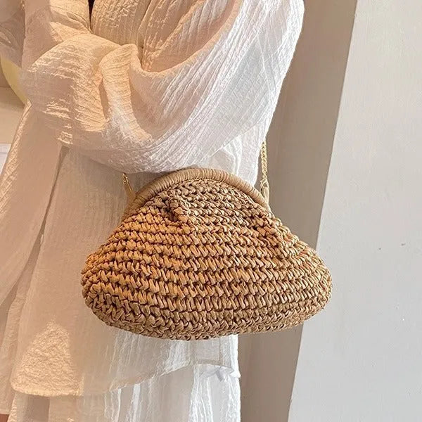 Khaki shell-shaped straw shoulder bag for women with chain detail and an internal zipper pocket.