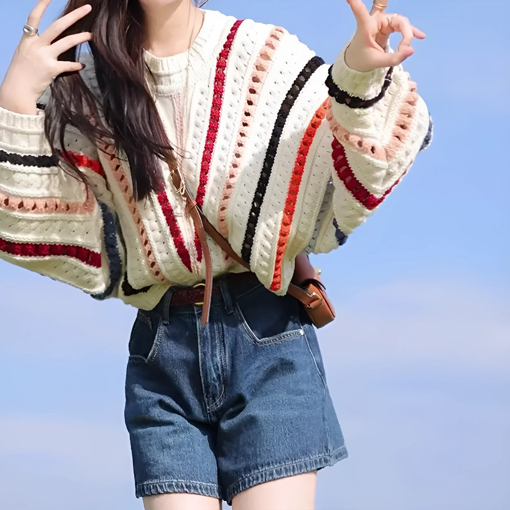 Colourful rainbow striped pullover sweater with batwing sleeves and hollow knit texture