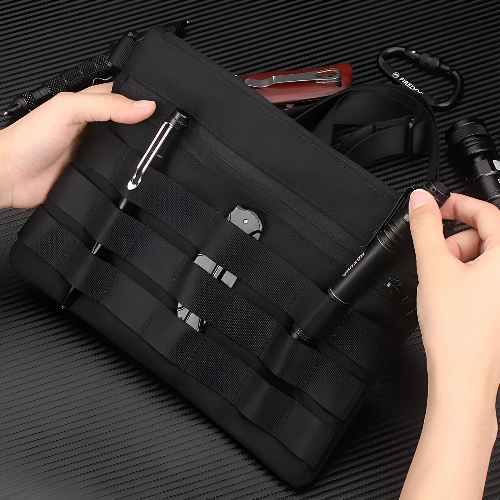 Black Oxford cloth portable outdoor kit measuring 18 by 3.5 centimetres for military enthusiasts