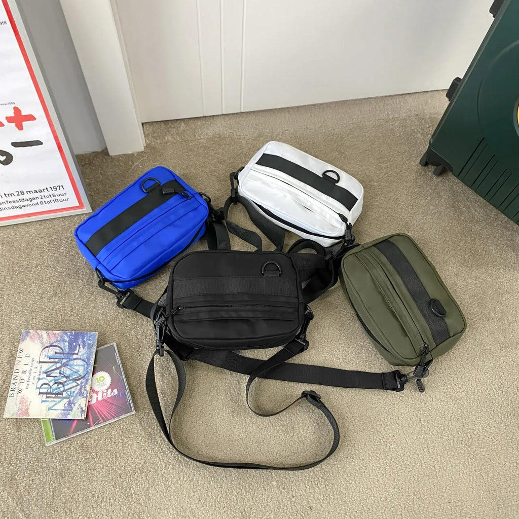 Men's street style nylon messenger bag in crossbody configuration with sewing thread detailing