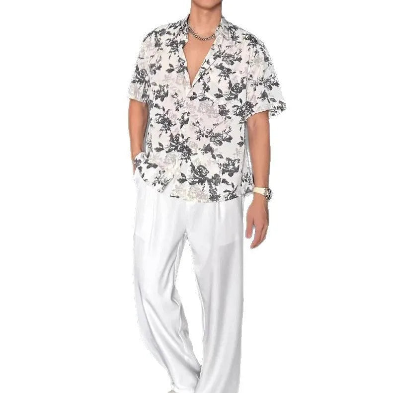 Loose casual printed shirt with short sleeves and floral pattern in white or black options