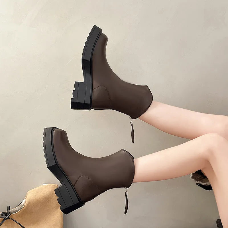 Black platform Martin booties for women with a square toe, back zipper, and a mid-calf height.