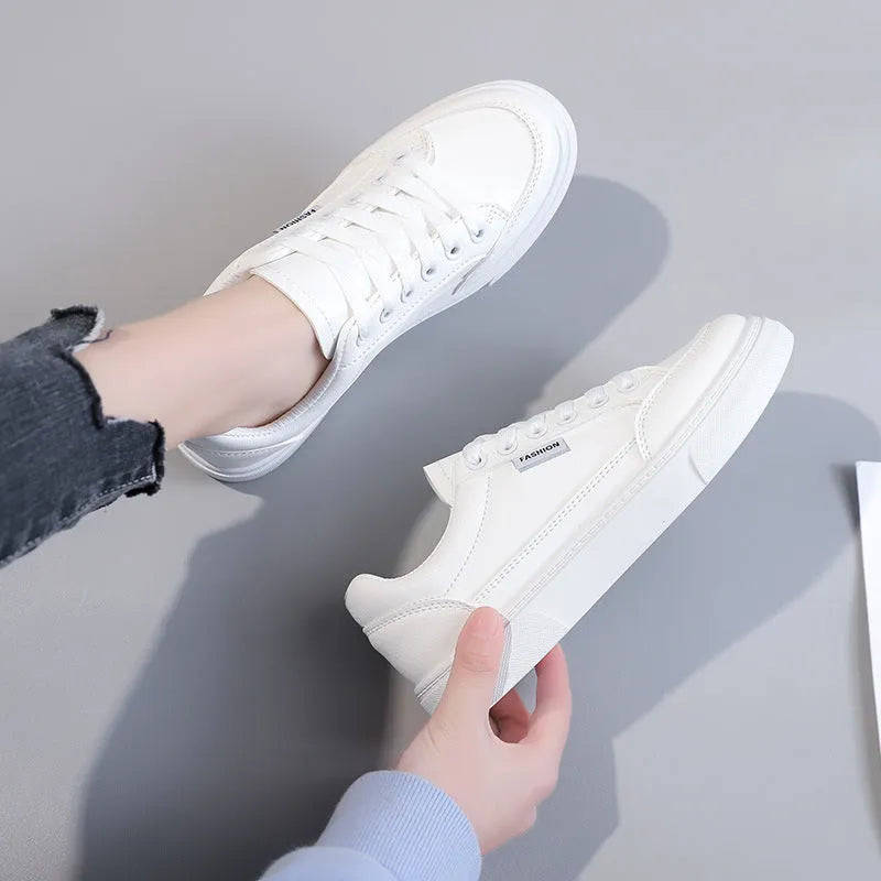 Low-top Korean-style sneakers in white or brown with artificial PU upper and plastic sole.