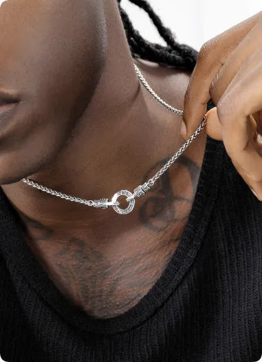 Simple sterling silver S925 necklace on a white background, showing a close-up of the chain links.