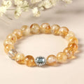 Citrine crystal bracelet with 10mm polished geometric beads on wrist