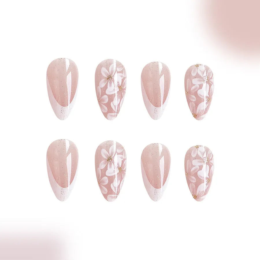 Short almond press on nails with French tip, flower pattern and glitter powder in C625 style