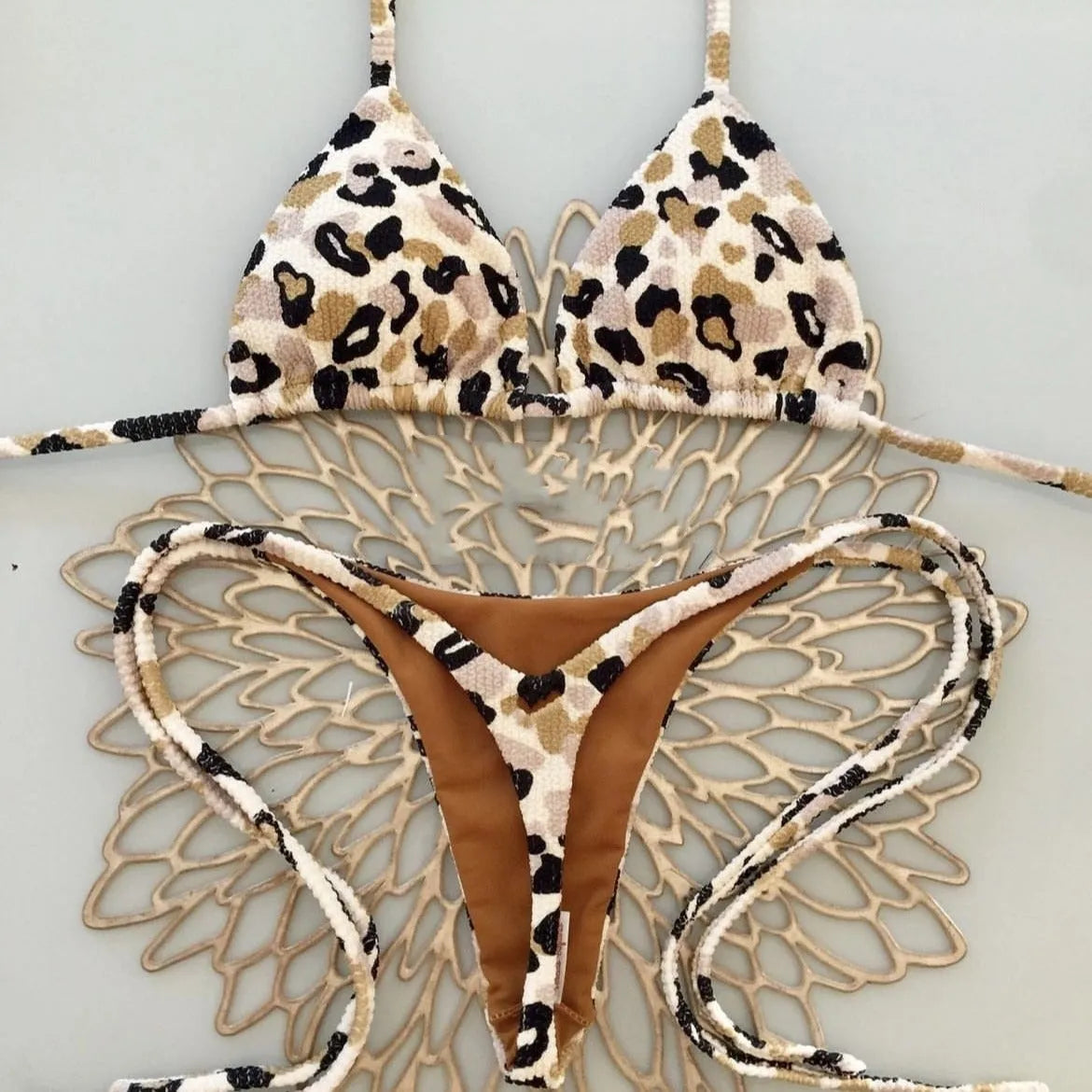 Women's printed beach bikini swimsuit with cotton lining on mannequin