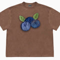 Loose fit blueberry patchwork T-shirt in ice oxygen cotton on hanger, showing floral design and short sleeves.