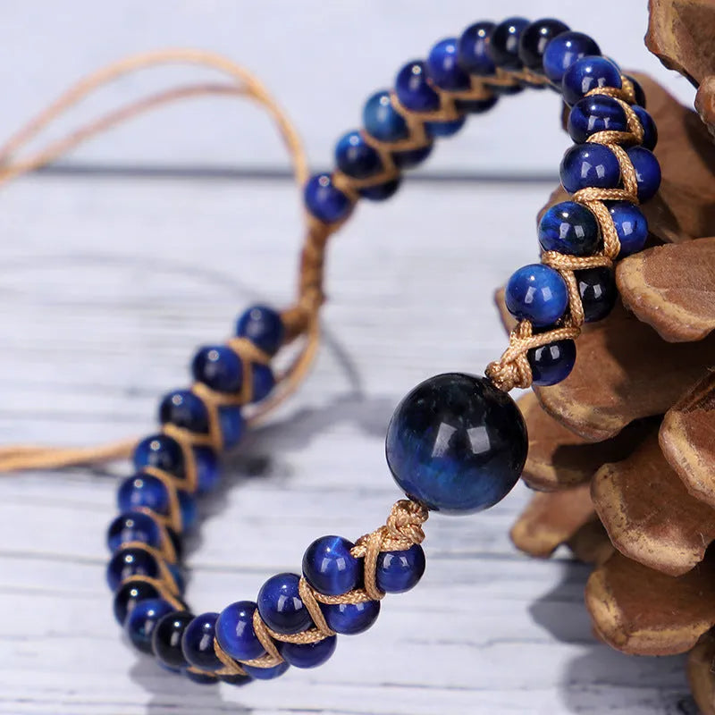 Hand-woven geometric bracelet made from tigereye stone with an adjustable sliding knot, shown in blue colour