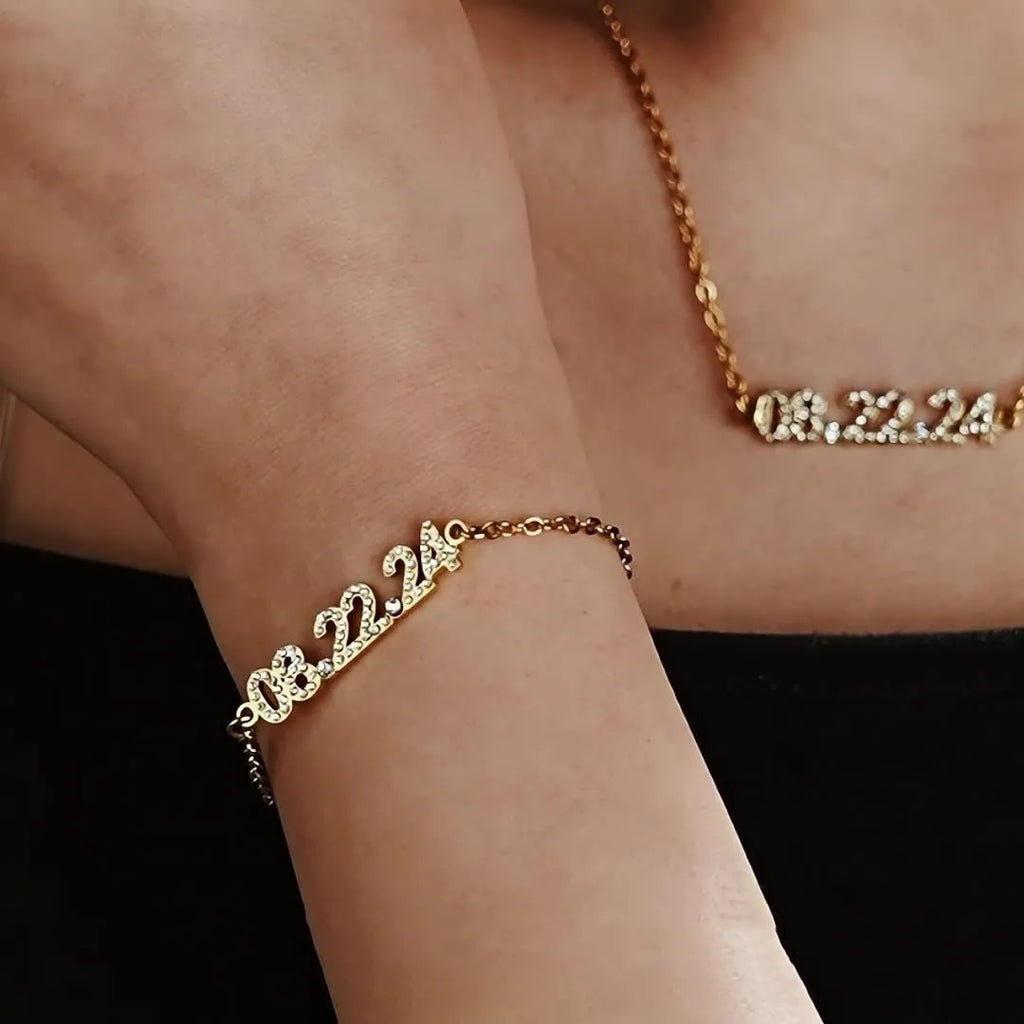 Stainless steel digital bracelet with diamond-set numbers on display, shown in gold colour.