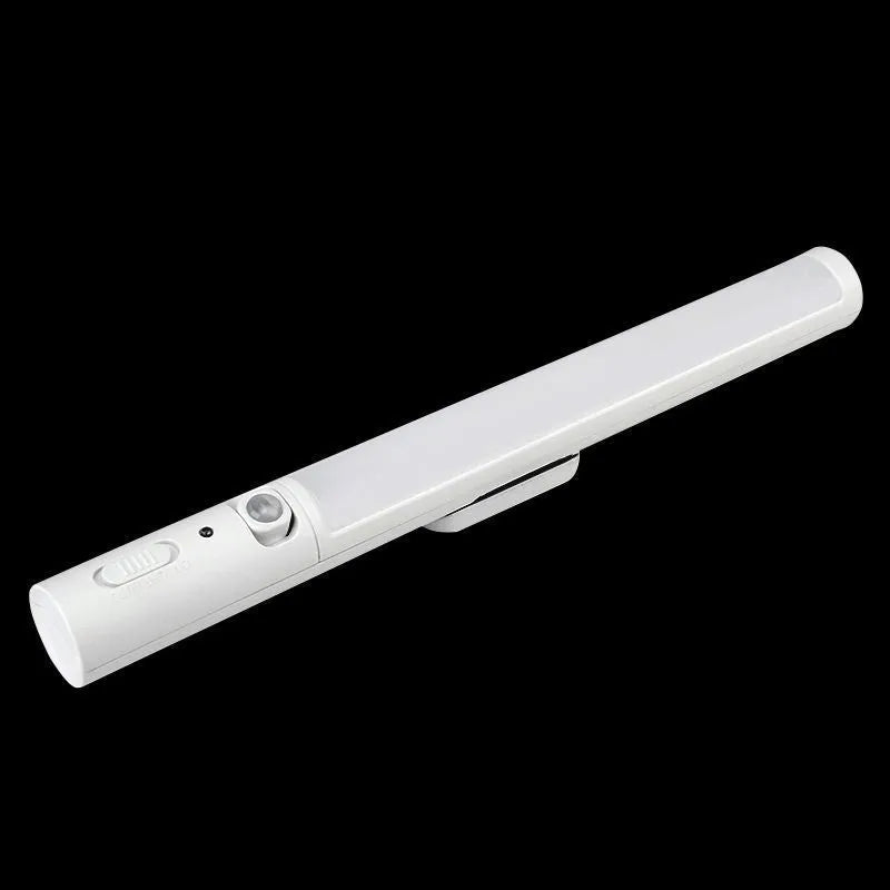 Slim white human induction cabinet wall light with magnetic back for installation on metal surfaces