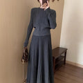 Dark grey knitted women's long dress suit with sweater, skirt, and 3D artistic pattern.
