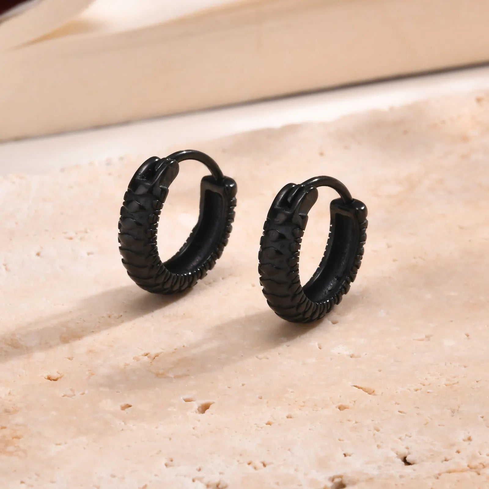 Stainless steel snake pattern hip hop ear rings in black and gold options for pierced ears