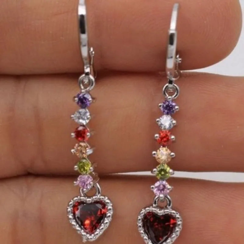 A pair of women's heart-shaped drop earrings with a gold electroplated finish.