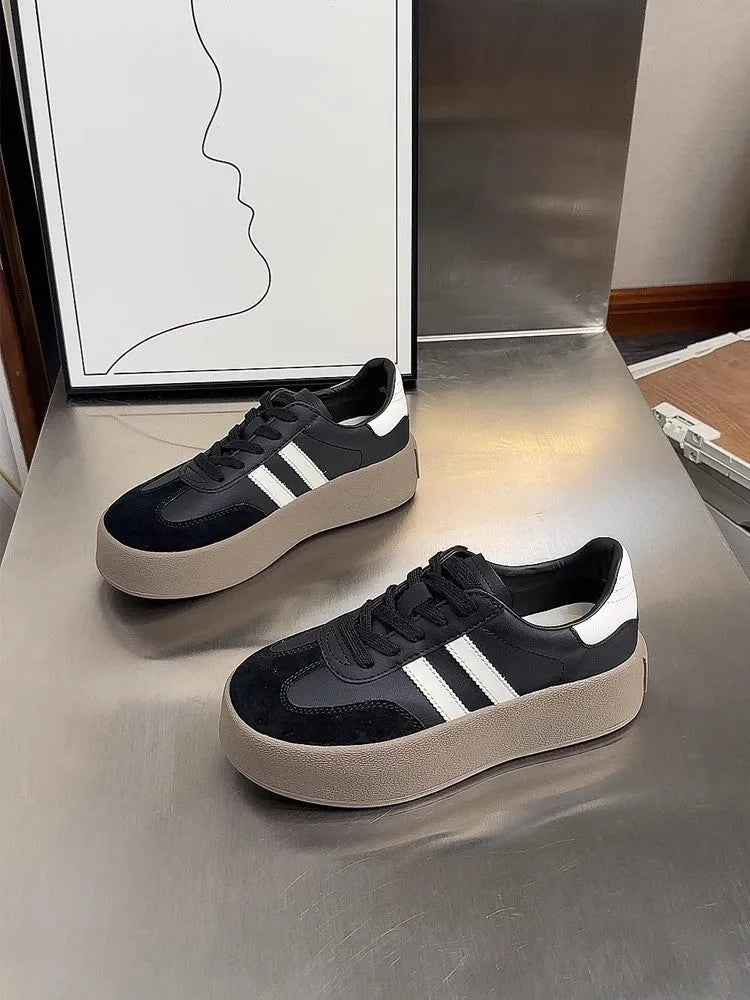 Women's vintage distressed leather sneakers with round toe and lace-up front closure