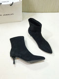 Women's black ankle boots with pointed toe and stiletto heel, mid-calf length