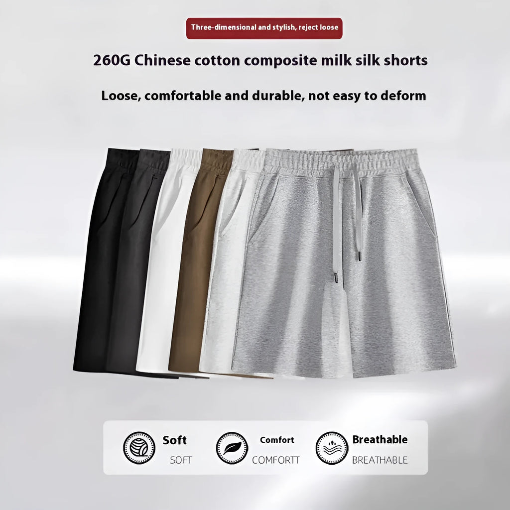 A pair of straight-cut cotton summer shorts in a neutral colour on a plain background.