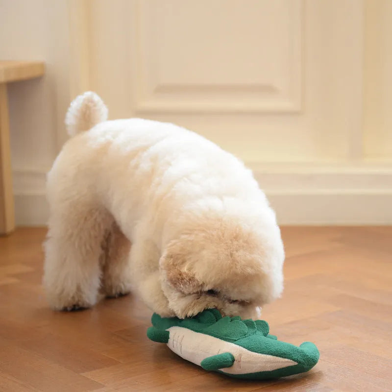 Green soft plush dog toy on a white background, showing its size and texture.