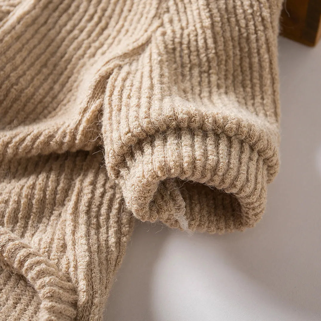 Brown knitted dog sweater pullover on small dog showing cloth construction and casual style