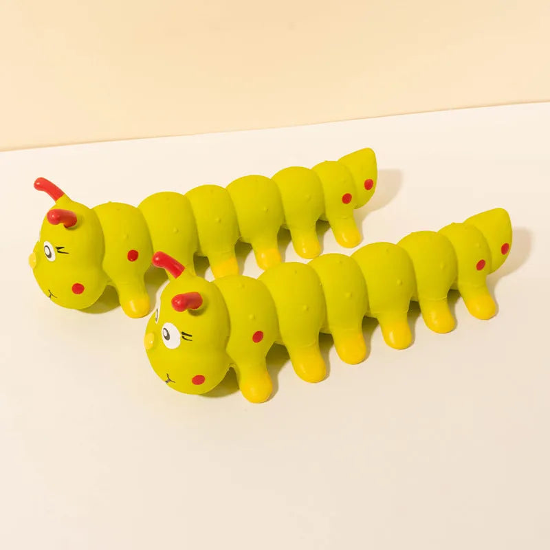 Yellow caterpillar-shaped rubber squeaky dog toy for small medium breeds.