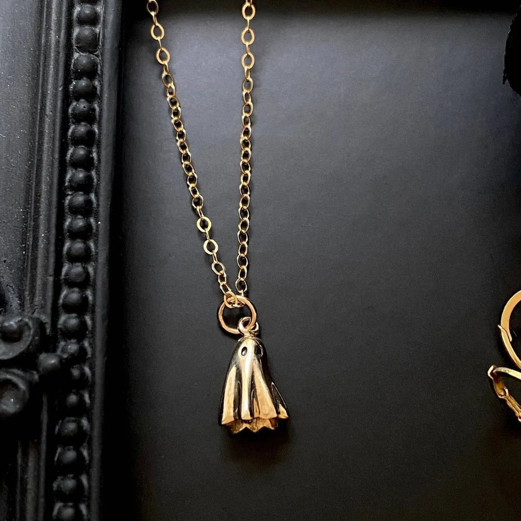 Stainless steel ghost pendant necklace with electroplated titanium steel centrepiece on twisted chain