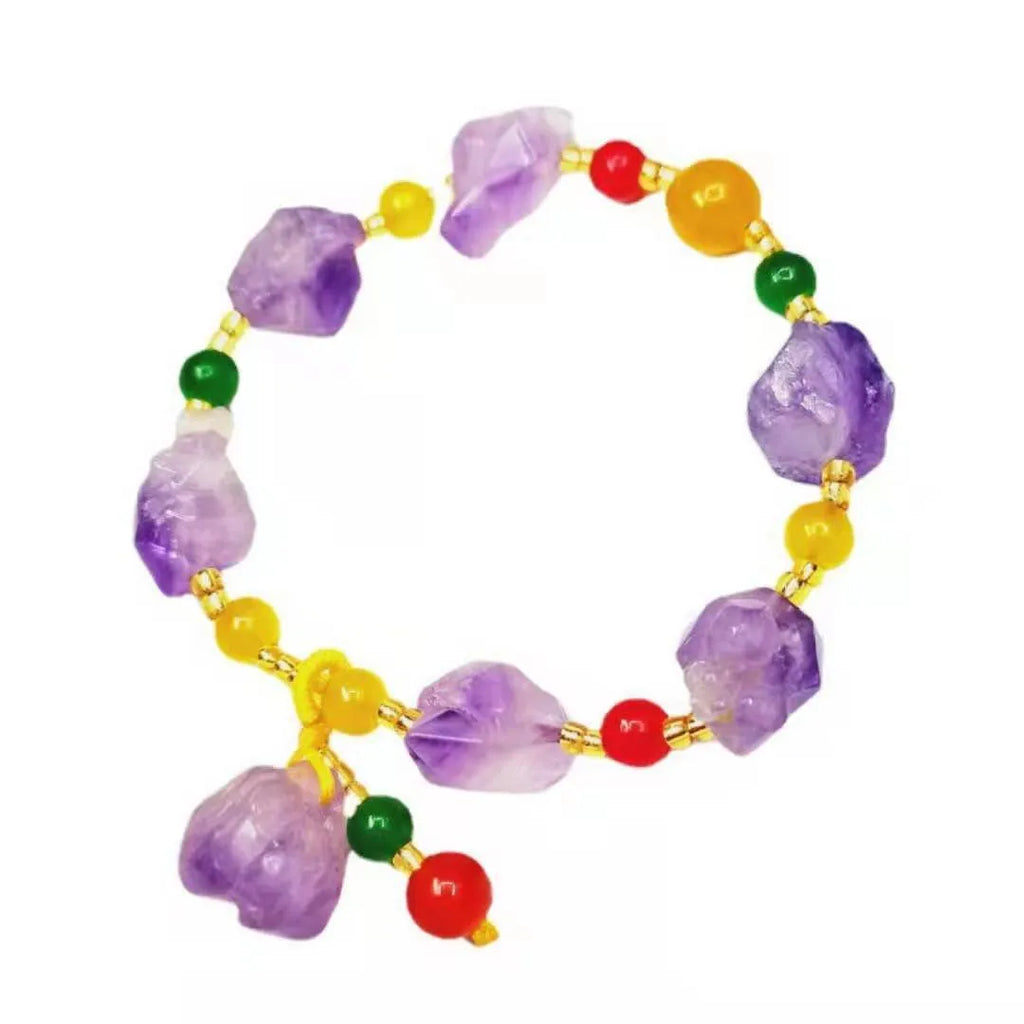 Natural shaped purple amethyst bead bracelet for women with a fu charm.