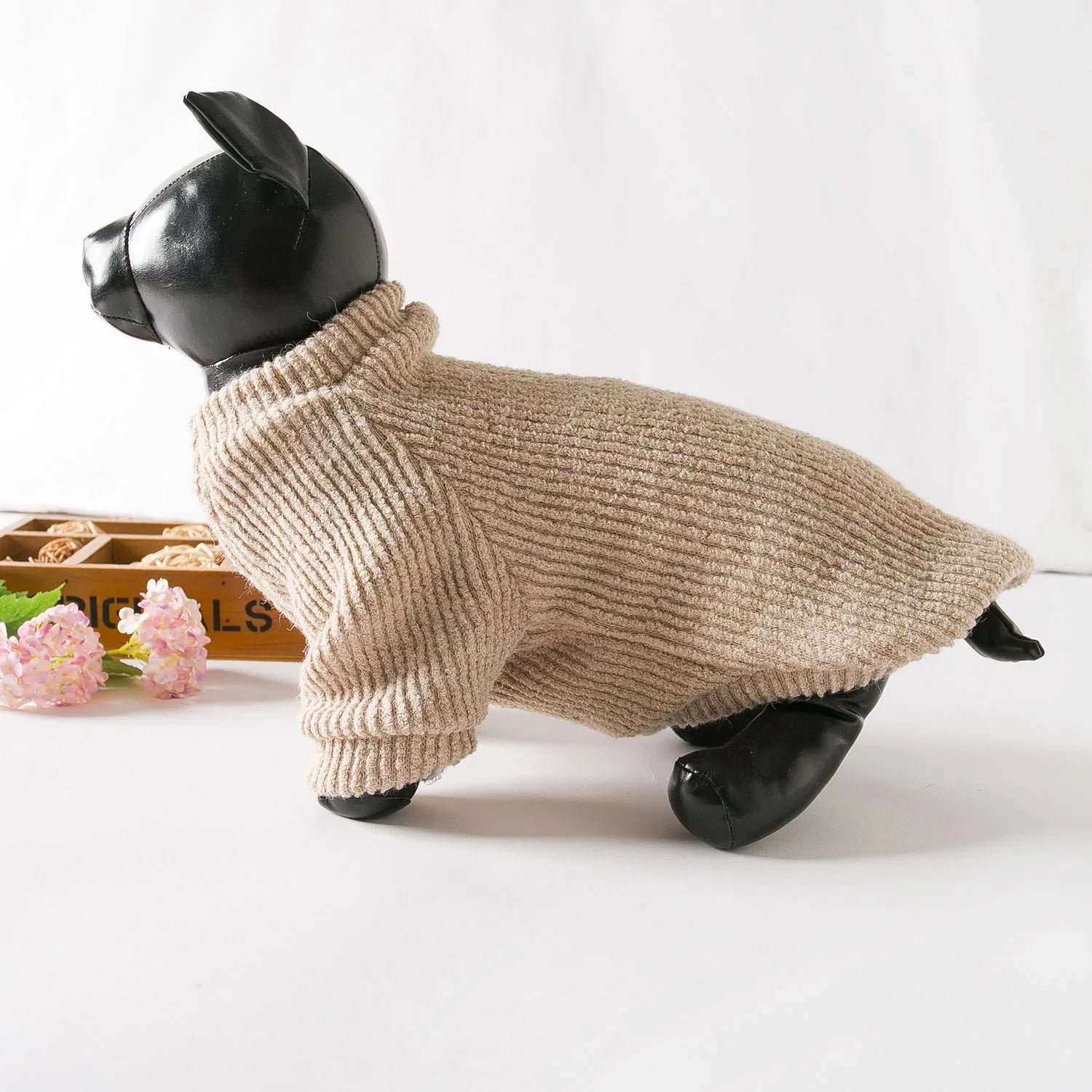 Brown knitted dog sweater pullover on small dog showing cloth construction and casual style