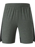 Men's five-point spandex shorts in forest green, mid-waist design for casual wear