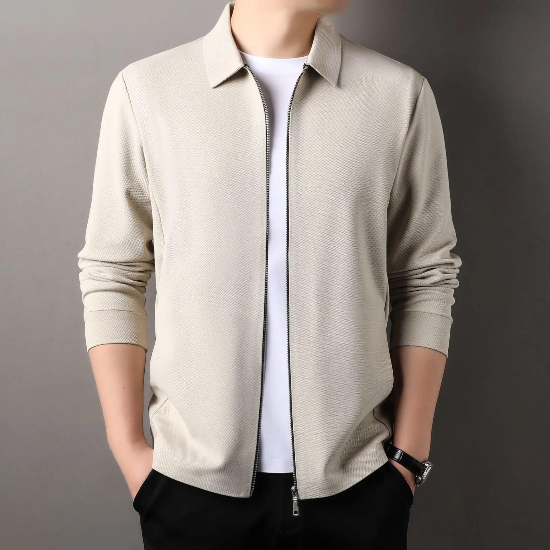 Men's apricot-coloured polyester business jacket with long sleeves and a straight hem on a hanger.