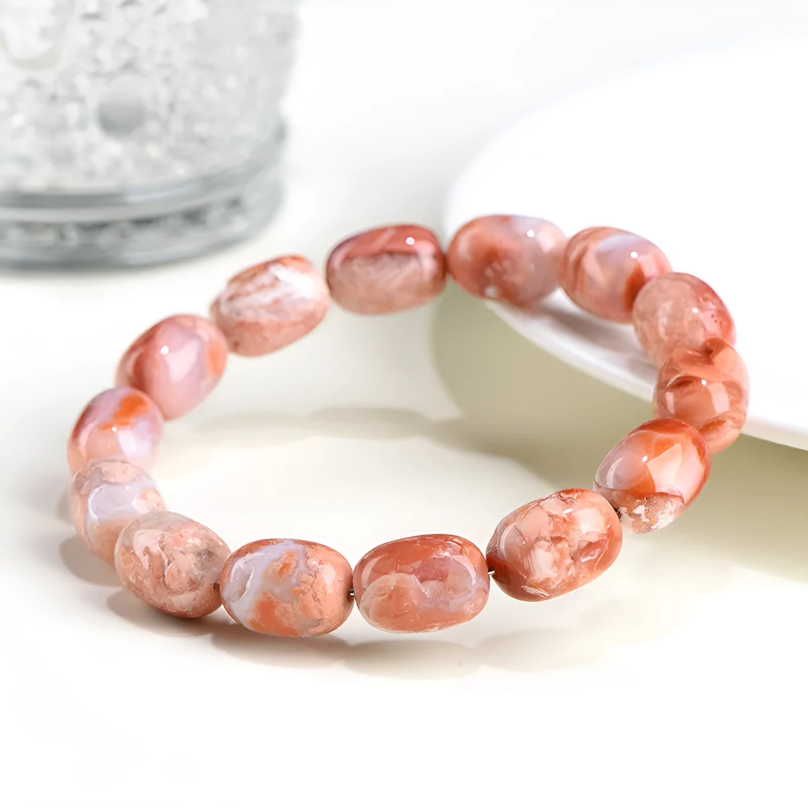 Natural cherry agate barrel bead bracelet with Ruyi pattern measuring 10x14mm