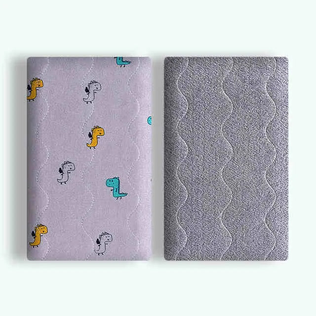 Double-sided cotton velvet pet blanket with dinosaur print, shown in a dog bed.
