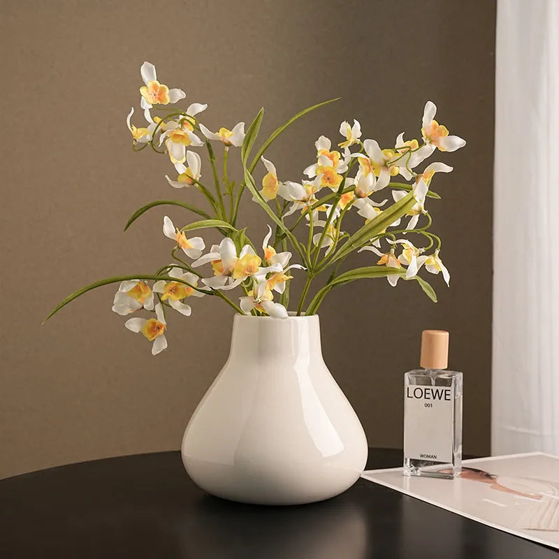 Ceramic decorative vase with artificial orchid flowers in black or white colour options