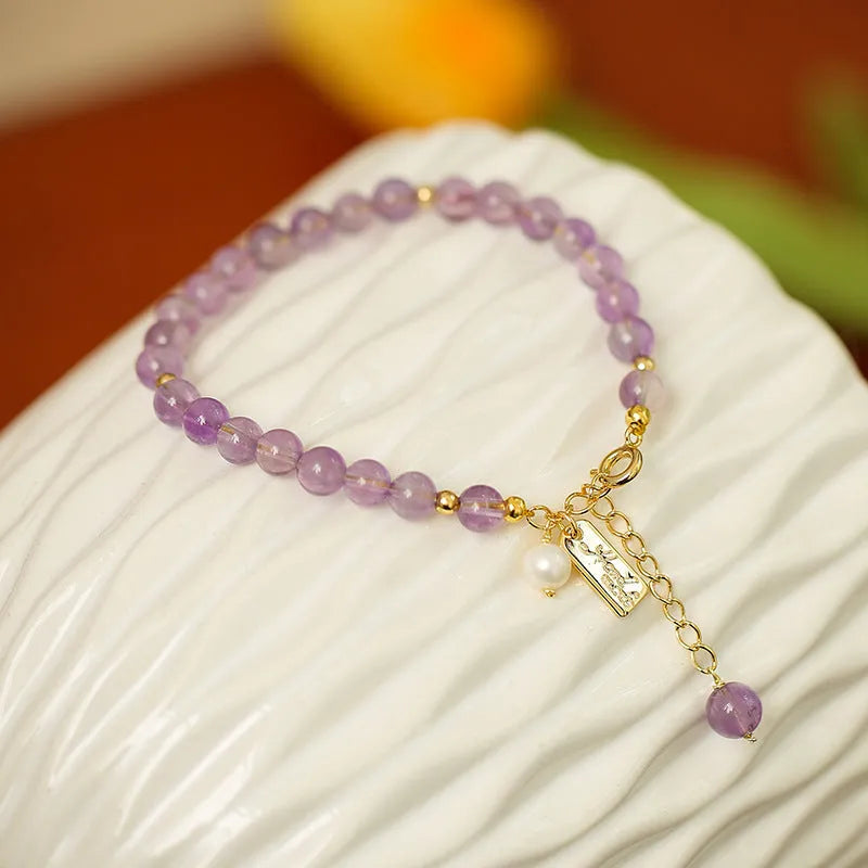 Women's lavender amethyst crystal bracelet with animal zodiac design in dark and light colour options