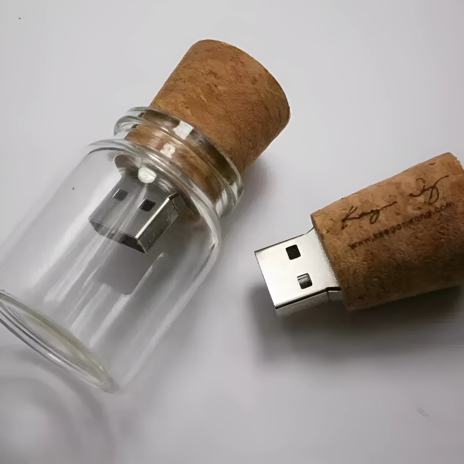 Transparent wooden wish drift bottle shaped USB flash drive on white background.