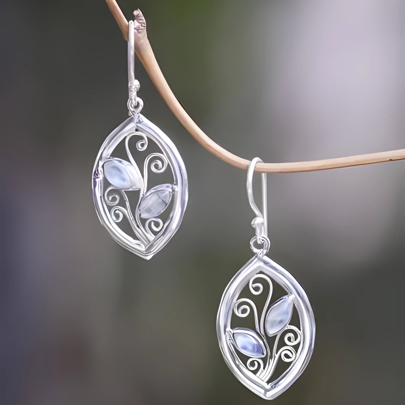 Silver-coloured alloy leaf earrings with embedded colourful moonstone gemstones for women.