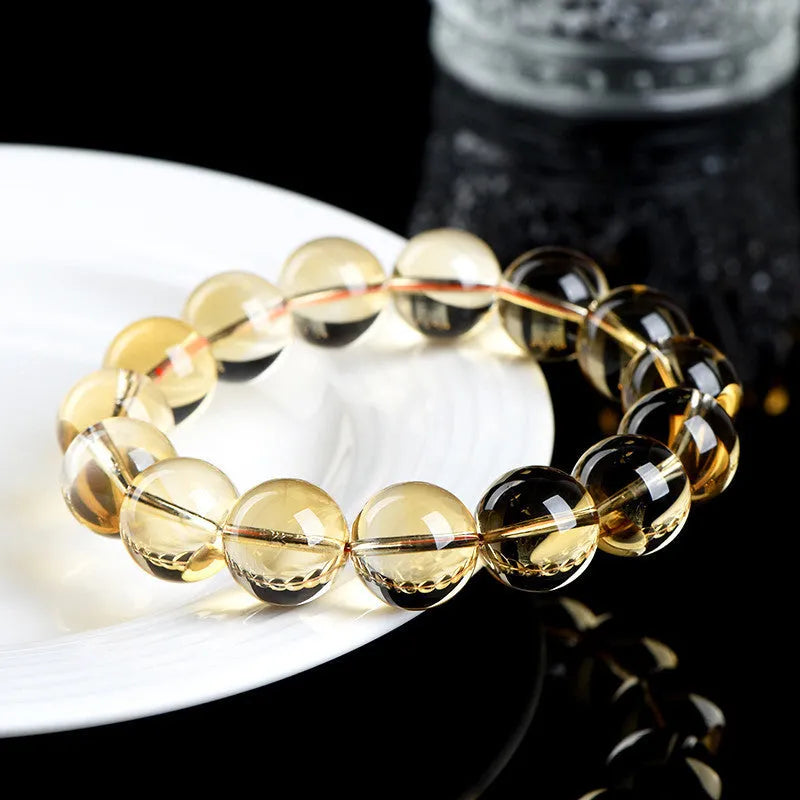 Natural citrine scattered beads bracelet showing polished gemstone beads on a cord.