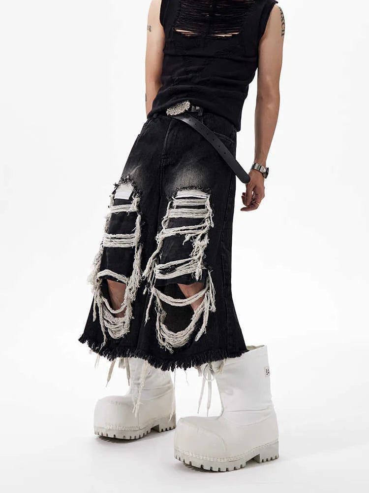 Black cropped wide leg jeans with ripped patch details and mid-high waist