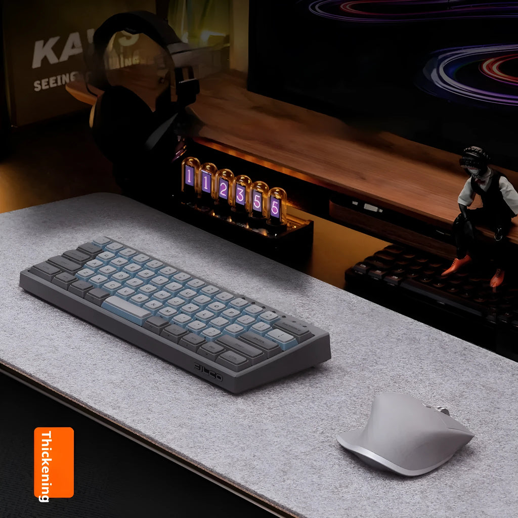 Winter warm grey and black felt desk mouse mat with cork non-slip base on a wooden table.