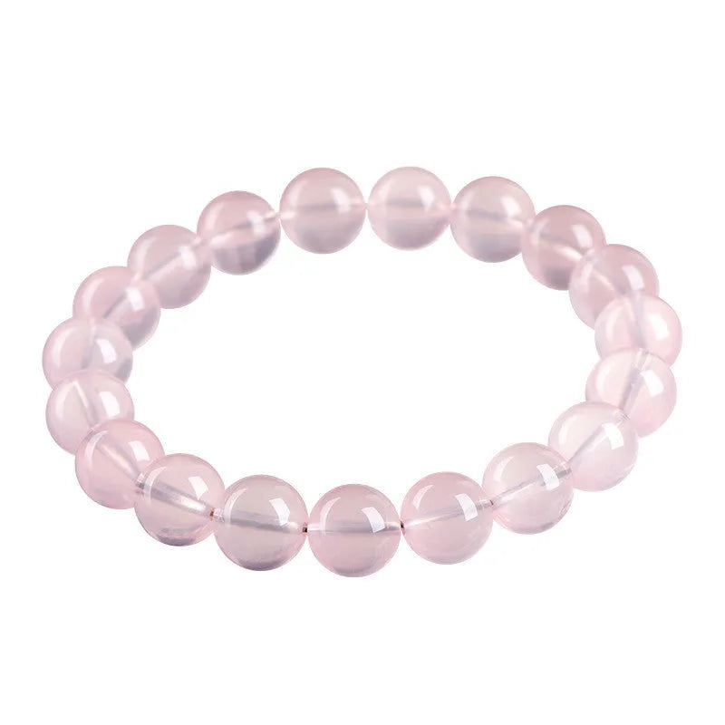 Women's natural starlight crystal bracelet with polished round pink beads in single circle configuration