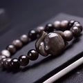 Obsidian stone bracelet with detailed fox charm on polished 8mm stone