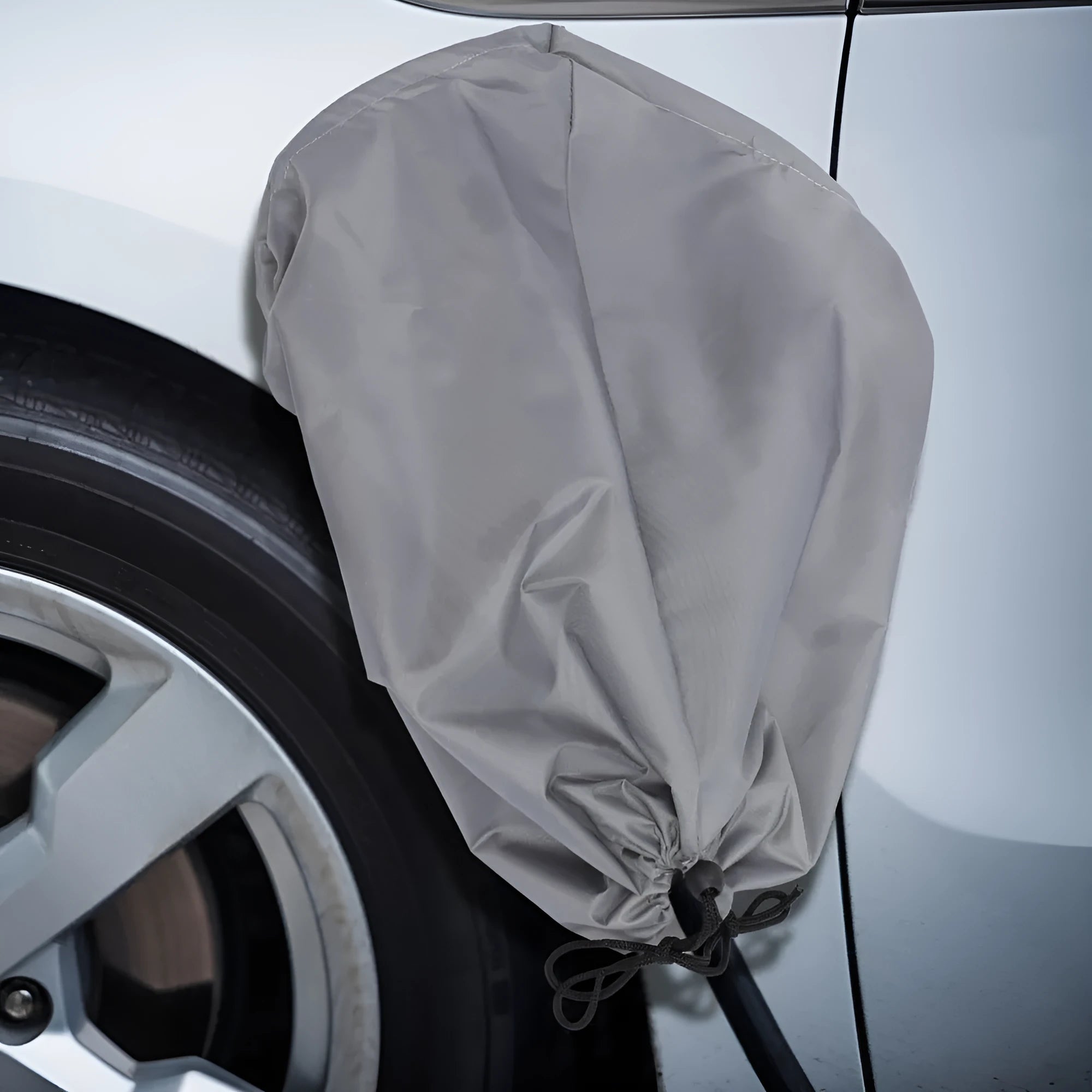 New energy vehicle charging port waterproof cover in grey colour with drawstring closure