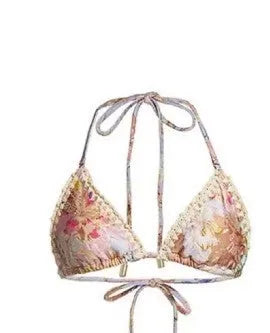 Women's creamy-white floral bikini set with removable skirt on size label